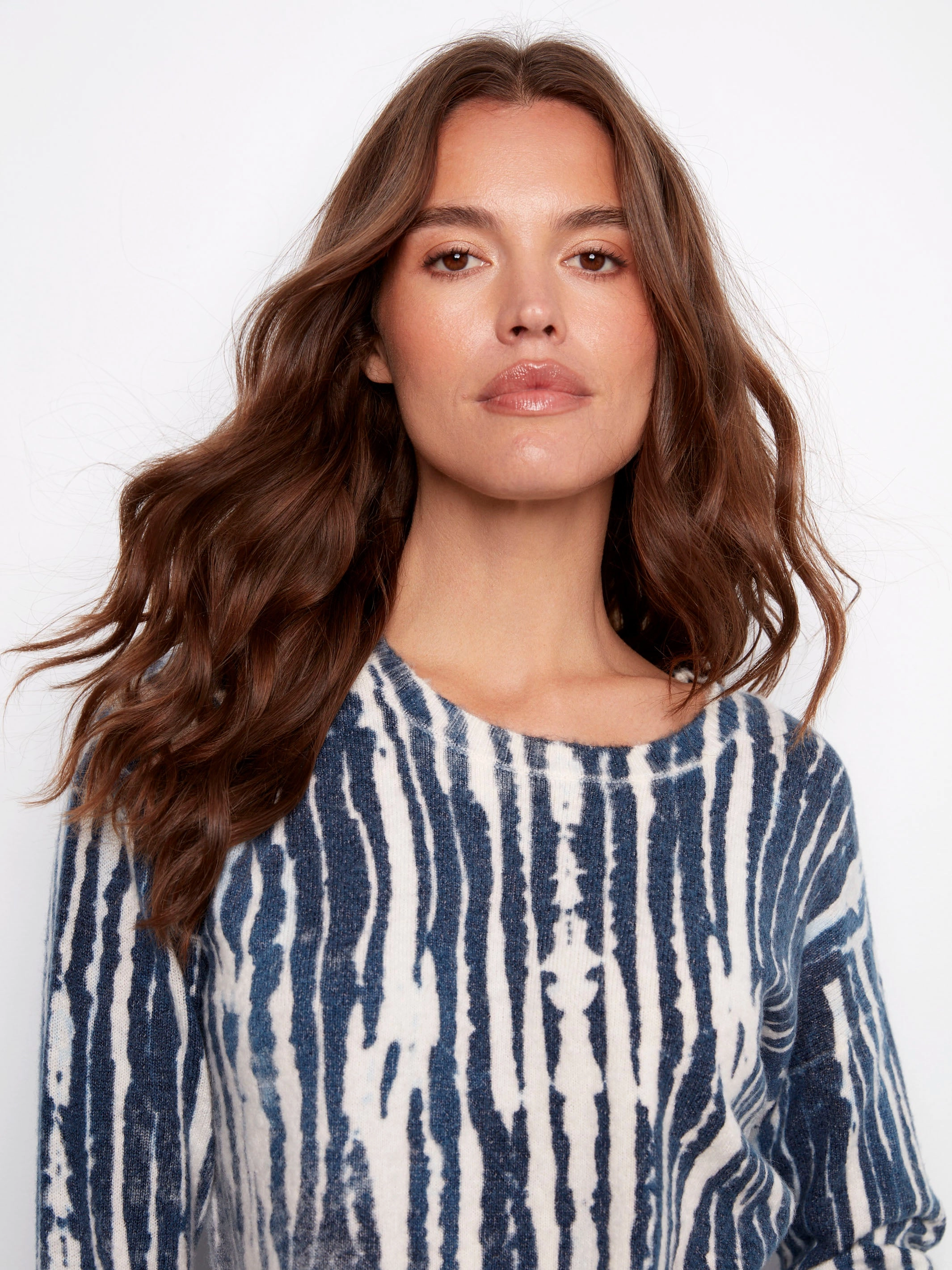 Reversible Printed Plush Sweater With Frayed Edges - Stream Indoor setting