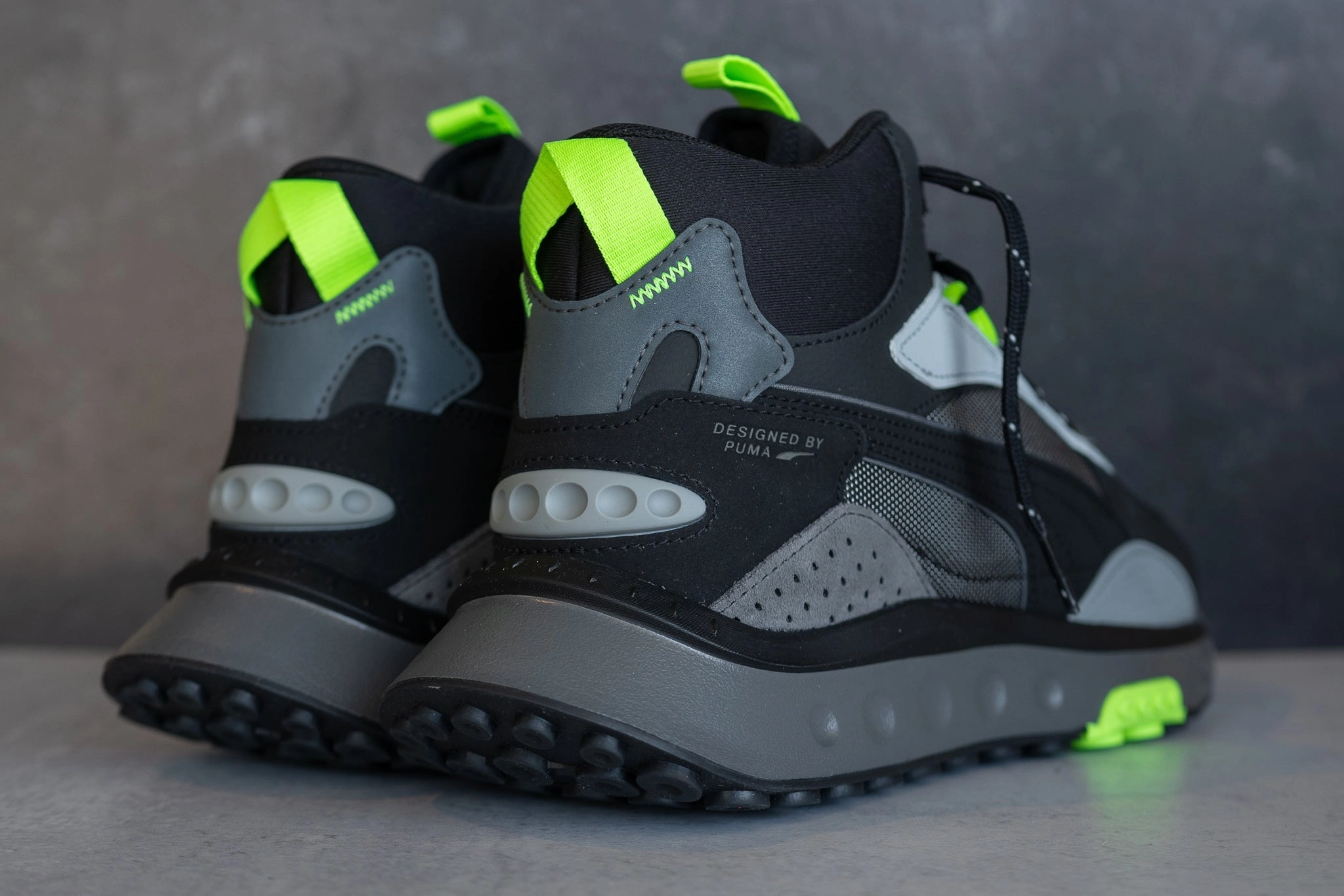 Puma Wild Rider Mid WS (Puma Black/Volt) Active Wear Durable Lace System